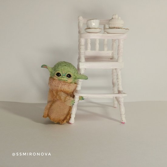 Baby Yoda in a baby chair for feeding by Svetlana Mironova Bear Pile