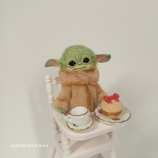 Baby Yoda in a baby chair for feeding by Svetlana Mironova Bear Pile